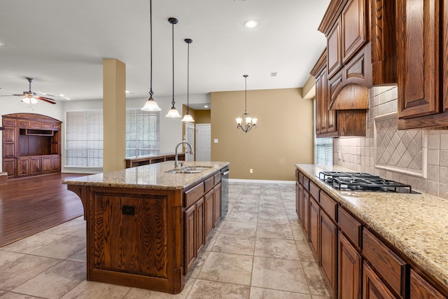 1205 Wynne Dr, Garland, TX 75044 - kitchen featuring appliances with stainless steel finishes, ceiling fan, tasteful backsplash, baseboards, and a sink