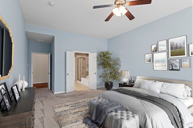 1205 Wynne Dr, Garland, TX 75044 - bedroom with light colored carpet, connected bathroom, and ceiling fan