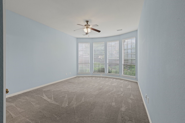 1205 Wynne Dr, Garland, TX 75044 - carpeted empty room featuring a ceiling fan and baseboards