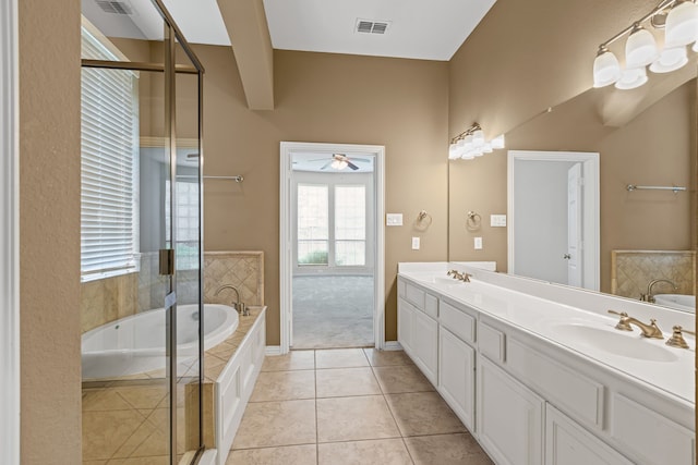 1205 Wynne Dr, Garland, TX 75044 - full bathroom featuring a ceiling fan, a garden tub, double vanity, tile patterned flooring, and a shower with door