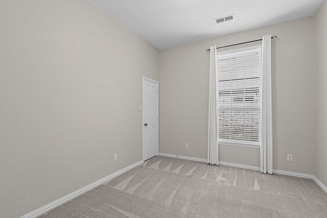 1205 Wynne Dr, Garland, TX 75044 - empty room with light colored carpet and baseboards