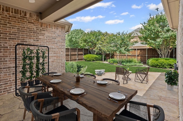 1205 Wynne Dr, Garland, TX 75044 - fenced backyard featuring outdoor dining space and a patio