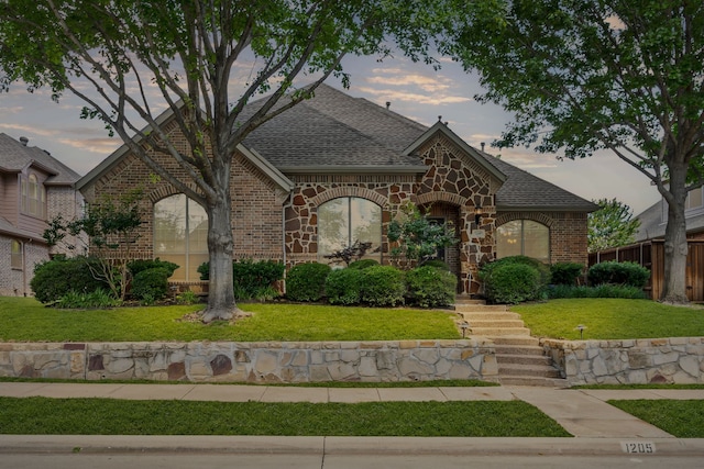 1205 Wynne Dr, Garland, TX 75044 - view of front of property with brick siding, a shingled roof, and a front yard