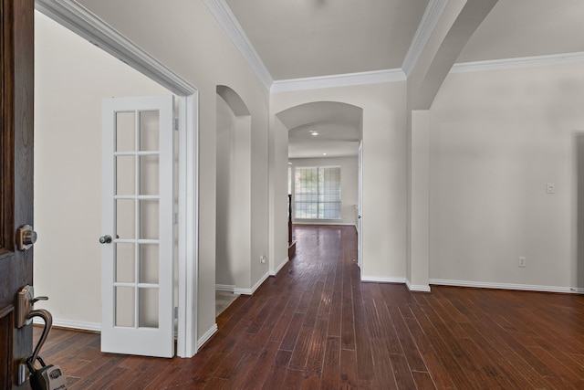 1205 Wynne Dr, Garland, TX 75044 - hall with arched walkways, crown molding, wood finished floors, and baseboards