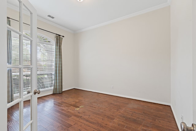 1205 Wynne Dr, Garland, TX 75044 - unfurnished room featuring healthy amount of natural light, french doors, crown molding, hardwood / wood-style floors, and baseboards