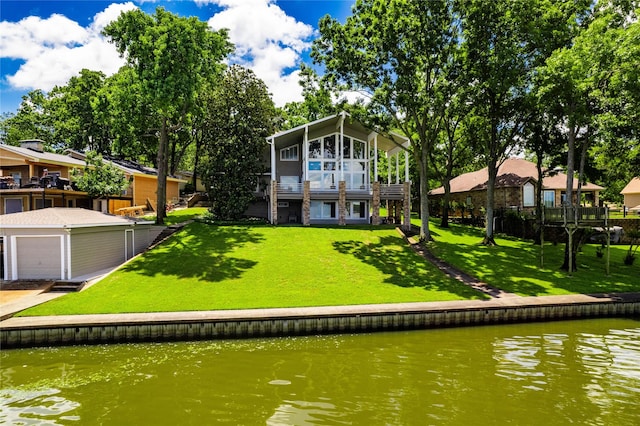 1232 Whispering Springs Dr, Tool, TX 75143 - rear view of property featuring a garage, a water view, and a yard