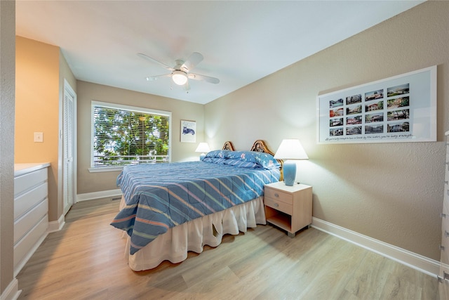 1232 Whispering Springs Dr, Tool, TX 75143 - bedroom featuring wood finished floors, baseboards, ceiling fan, a closet, and a textured wall