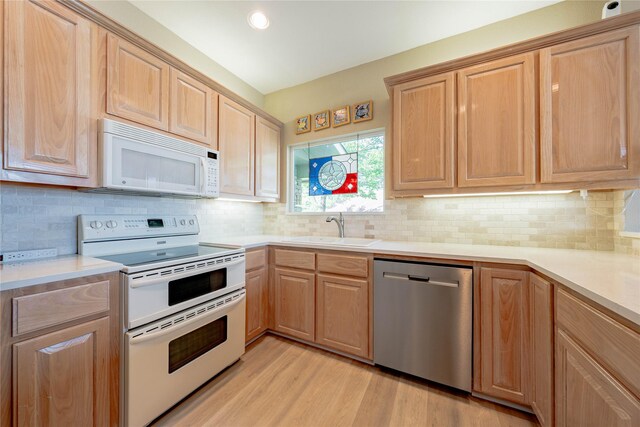1232 Whispering Springs Dr, Tool, TX 75143 - kitchen with white appliances, a sink, light brown cabinetry, light wood finished floors, and recessed lighting