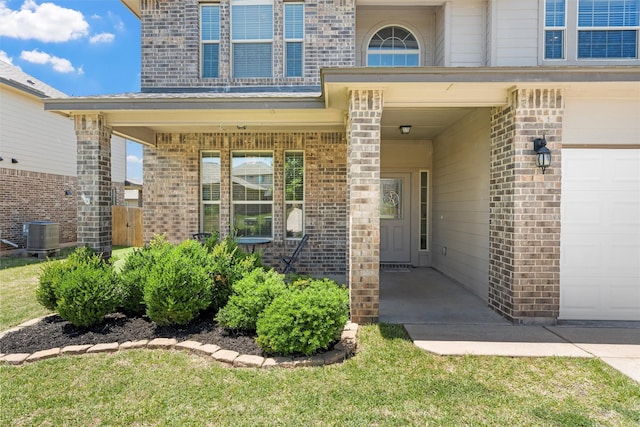 11108 Buzzard Gulch Dr, Waco, TX 76708 - property entrance featuring brick siding, a garage, and central AC unit
