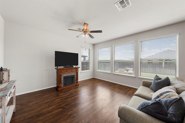 11108 Buzzard Gulch Dr, Waco, TX 76708 - living area with a ceiling fan, dark wood-type flooring, baseboards, and a fireplace