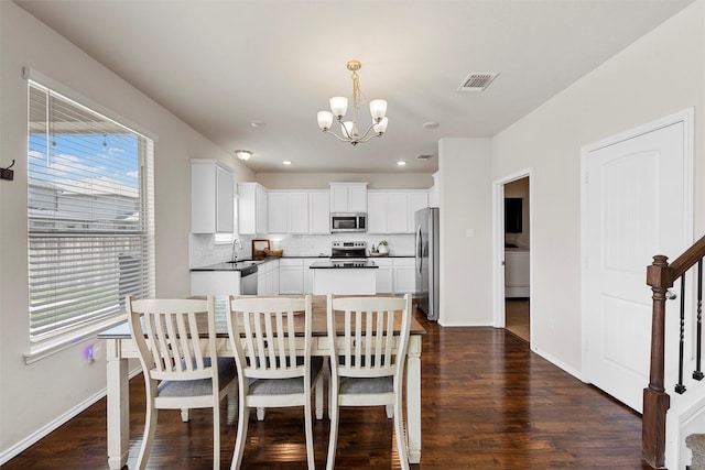 11108 Buzzard Gulch Dr, Waco, TX 76708 - dining room featuring a chandelier, plenty of natural light, dark wood finished floors, and recessed lighting