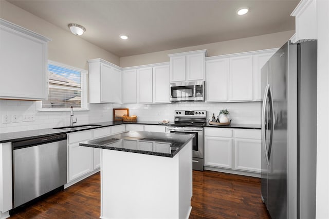 11108 Buzzard Gulch Dr, Waco, TX 76708 - kitchen with appliances with stainless steel finishes, a sink, white cabinets, tasteful backsplash, and recessed lighting