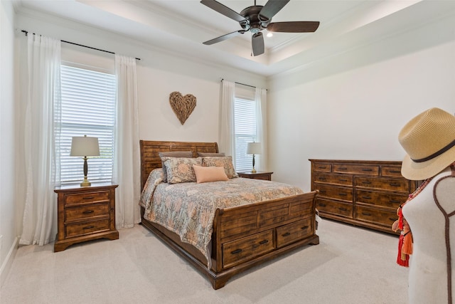 10136 Braided Briar Ln, Waco, TX 76712 - carpeted bedroom with multiple windows, crown molding, a tray ceiling, and ceiling fan