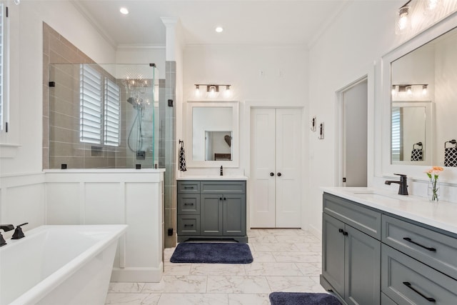 10136 Braided Briar Ln, Waco, TX 76712 - bathroom with a shower stall, two vanities, crown molding, a freestanding tub, and marble finish flooring