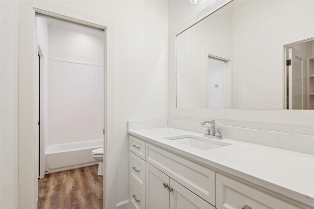 10136 Braided Briar Ln, Waco, TX 76712 - full bath with vanity, wood finished floors, and toilet