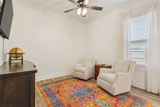 10136 Braided Briar Ln, Waco, TX 76712 - living area with light wood-style floors, a ceiling fan, ornamental molding, and baseboards