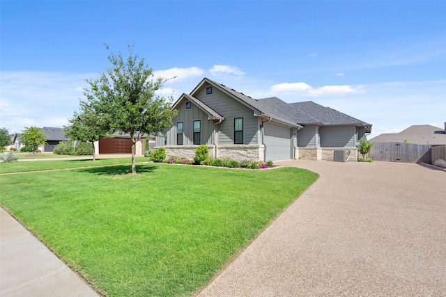 10136 Braided Briar Ln, Waco, TX 76712 - view of front of property with stone siding, a garage, driveway, central AC, and board and batten siding