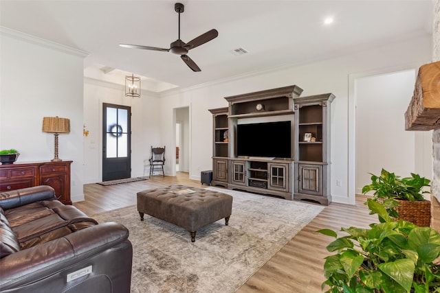 10136 Braided Briar Ln, Waco, TX 76712 - living room with light wood-style flooring, ceiling fan, ornamental molding, and baseboards