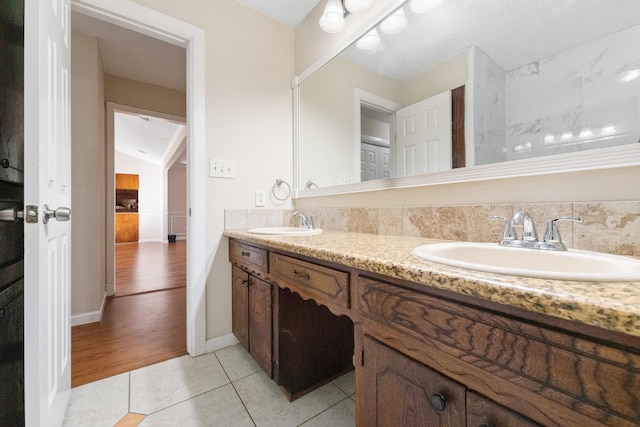 908 Cherry Laurel Ln, Arlington, TX 76012 - full bath featuring double vanity, tile patterned floors, and baseboards