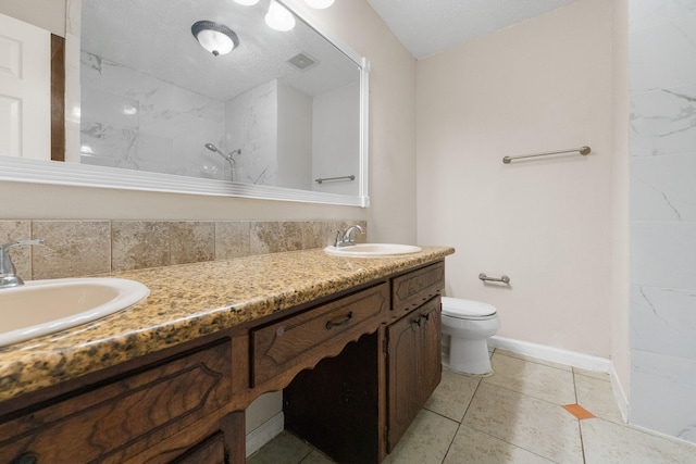 908 Cherry Laurel Ln, Arlington, TX 76012 - bathroom with toilet, a shower, double vanity, tile patterned floors, and baseboards
