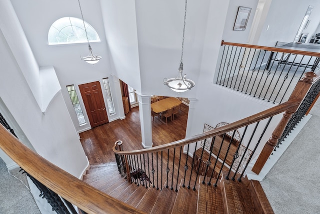 420 Bee Caves Rd, Lucas, TX 75002 - foyer featuring ornate columns, a towering ceiling, wood finished floors, and stairs