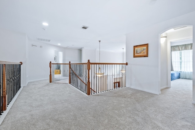 420 Bee Caves Rd, Lucas, TX 75002 - hallway with arched walkways, light colored carpet, baseboards, and recessed lighting