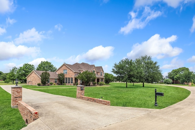 420 Bee Caves Rd, Lucas, TX 75002 - traditional-style house with a front yard, brick siding, and driveway