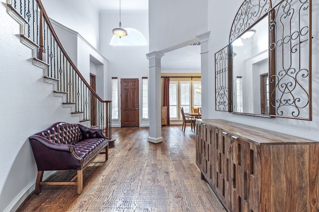 420 Bee Caves Rd, Lucas, TX 75002 - entrance foyer featuring decorative columns, dark wood-style floors, a high ceiling, stairs, and baseboards