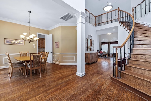 420 Bee Caves Rd, Lucas, TX 75002 - dining space featuring stairs, a chandelier, crown molding, dark wood finished floors, and wainscoting