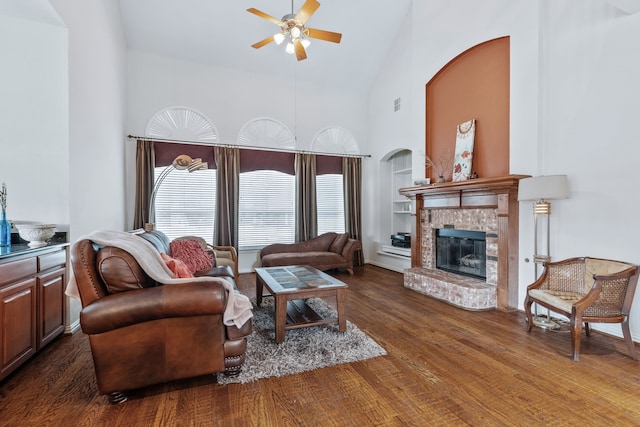 420 Bee Caves Rd, Lucas, TX 75002 - living area featuring high vaulted ceiling, ceiling fan, built in features, wood finished floors, and a brick fireplace