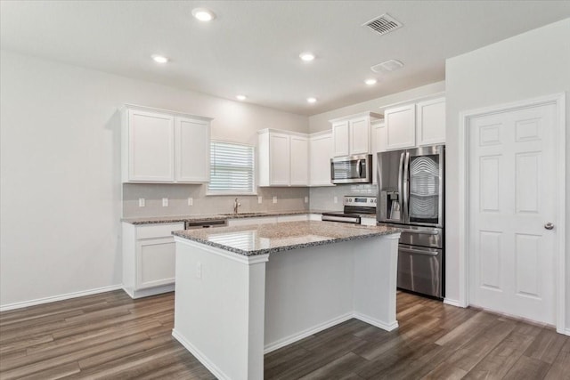 3220 Marston Rd, Lorena, TX 76655 - kitchen featuring stainless steel appliances, a center island, dark wood-type flooring, tasteful backsplash, and recessed lighting
