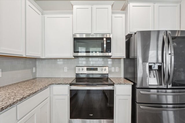 3220 Marston Rd, Lorena, TX 76655 - kitchen with appliances with stainless steel finishes, tasteful backsplash, white cabinets, and light stone counters