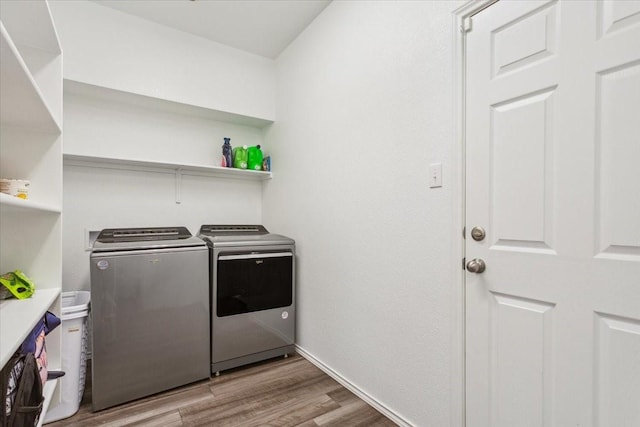 3220 Marston Rd, Lorena, TX 76655 - laundry area with washing machine and clothes dryer, light wood-style floors, and baseboards