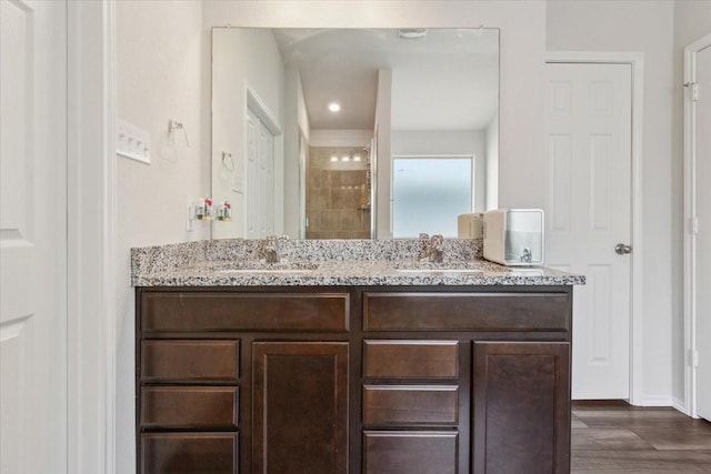 3220 Marston Rd, Lorena, TX 76655 - bathroom featuring a tile shower, double vanity, and baseboards