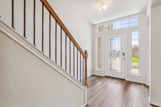 3220 Marston Rd, Lorena, TX 76655 - entrance foyer featuring plenty of natural light, wood finished floors, baseboards, and stairway