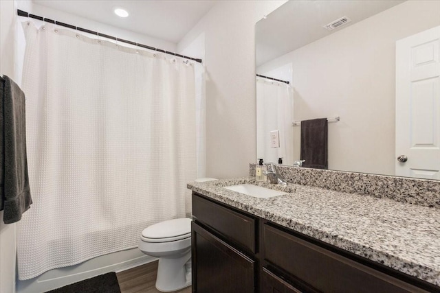 3220 Marston Rd, Lorena, TX 76655 - bathroom featuring toilet, wood finished floors, vanity, recessed lighting, and shower / bathtub combination with curtain