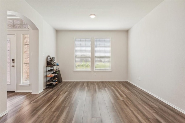 3220 Marston Rd, Lorena, TX 76655 - entryway with arched walkways, dark wood finished floors, and baseboards
