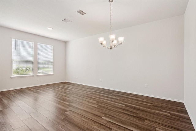 3220 Marston Rd, Lorena, TX 76655 - empty room with a chandelier, dark wood finished floors, and baseboards