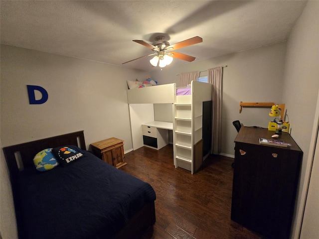 bedroom featuring dark wood-style floors, ceiling fan, and baseboards