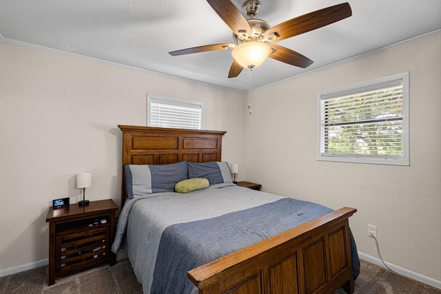 818 Country Club Rd, Bowie, TX 76230 - bedroom with dark carpet, baseboards, crown molding, and a ceiling fan
