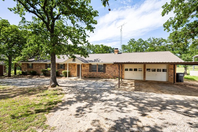 818 Country Club Rd, Bowie, TX 76230 - single story home featuring an attached garage, driveway, a chimney, and brick siding