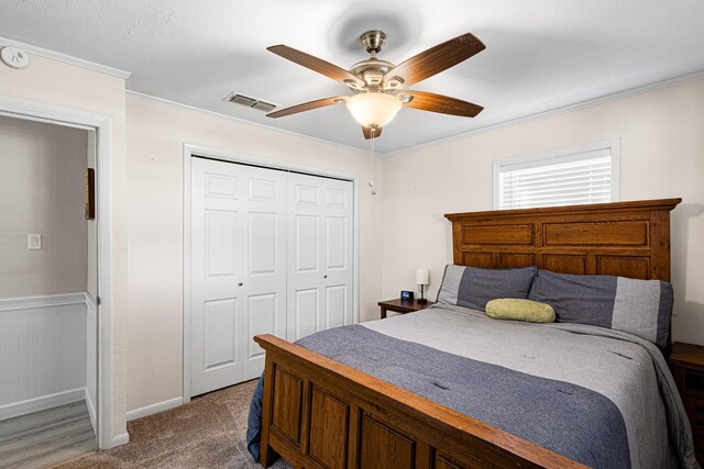818 Country Club Rd, Bowie, TX 76230 - bedroom featuring ornamental molding, baseboards, a closet, a ceiling fan, and carpet flooring