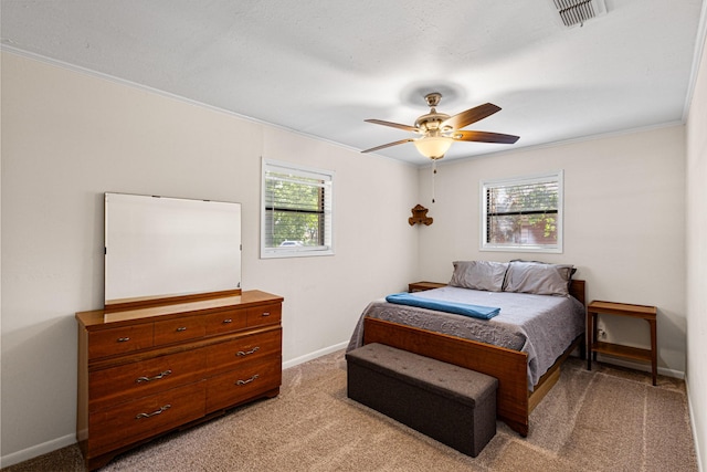 818 Country Club Rd, Bowie, TX 76230 - bedroom with multiple windows, ornamental molding, baseboards, and light colored carpet