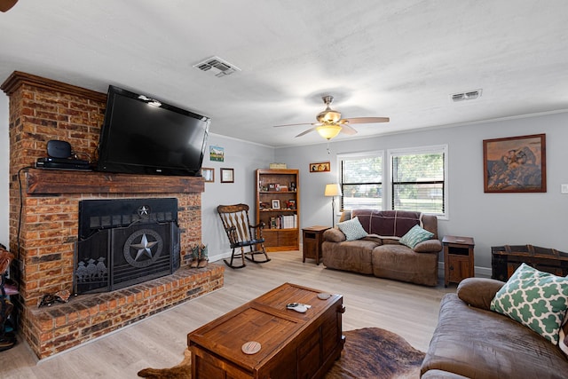818 Country Club Rd, Bowie, TX 76230 - living area featuring ceiling fan, wood finished floors, a fireplace, ornamental molding, and baseboards