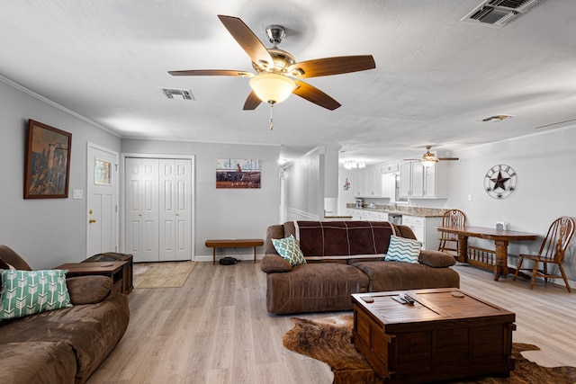 818 Country Club Rd, Bowie, TX 76230 - living area featuring ceiling fan, light wood-style floors, and baseboards