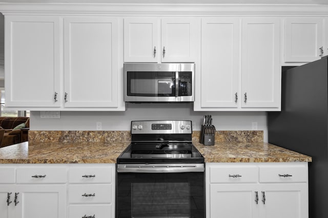 818 Country Club Rd, Bowie, TX 76230 - kitchen featuring stainless steel appliances, white cabinetry, and stone counters