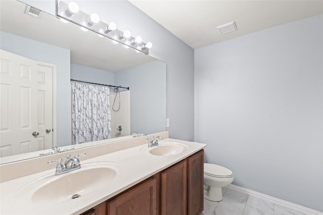 2813 Dana Ln, Denton, TX 76209 - bathroom featuring marble finish floors, toilet, double vanity, a shower with shower curtain, and baseboards