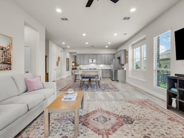 571 Mckenna Dr, Fate, TX 75087 - living area with light wood-type flooring, recessed lighting, ceiling fan, and baseboards