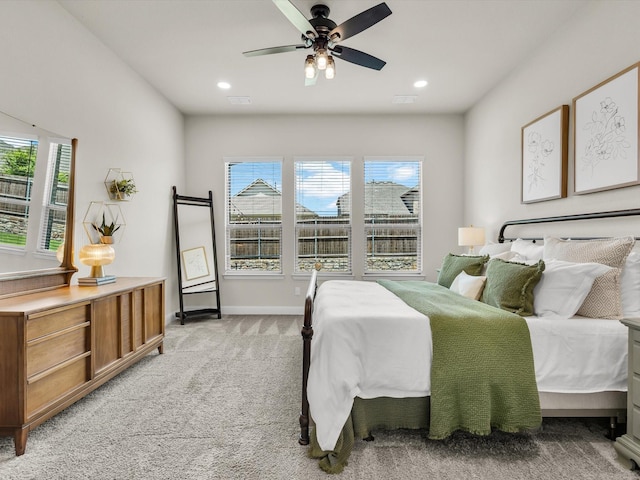 571 Mckenna Dr, Fate, TX 75087 - bedroom featuring multiple windows, recessed lighting, light carpet, baseboards, and ceiling fan