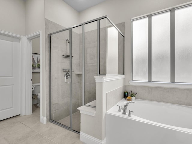 571 Mckenna Dr, Fate, TX 75087 - full bath featuring a shower stall, toilet, a bath, and tile patterned floors